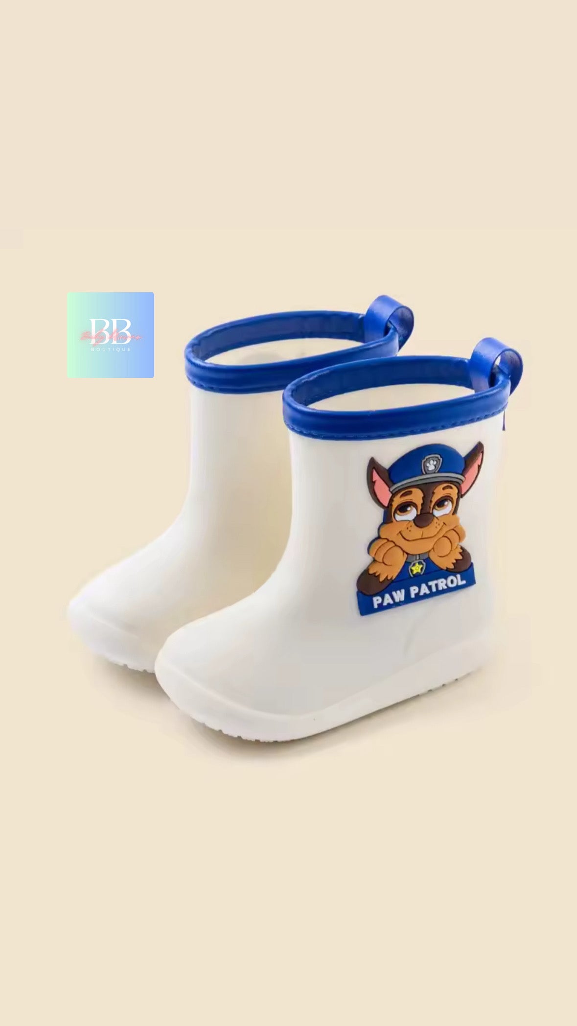 White rain boots with blue accents featuring a cartoon character on a beige background
