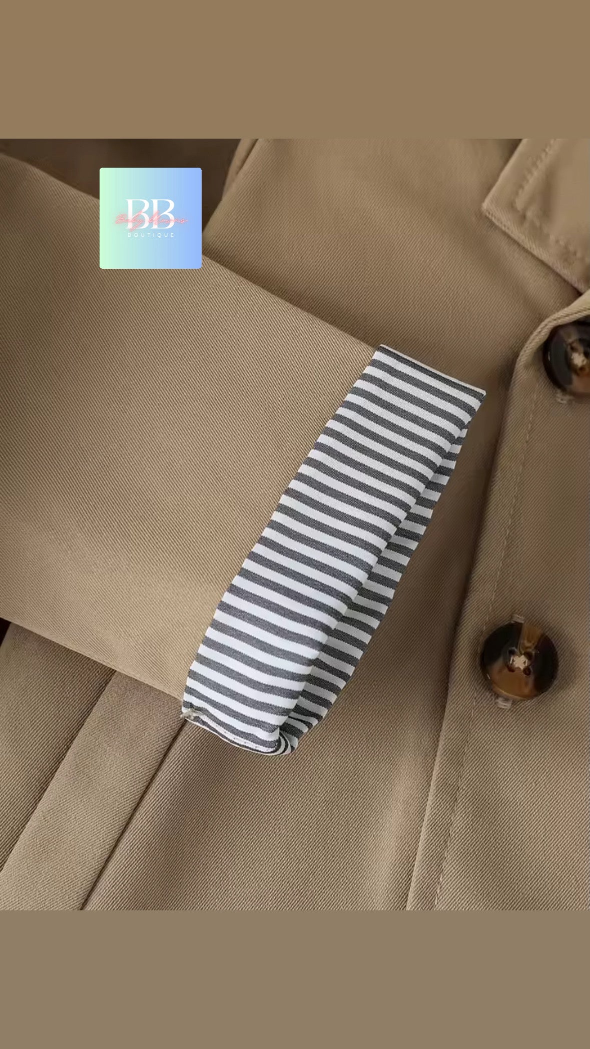 Striped tie on a beige coat with a button visible