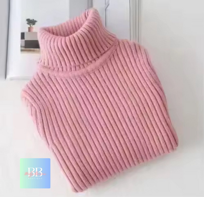 Pink ribbed sweater on a white background