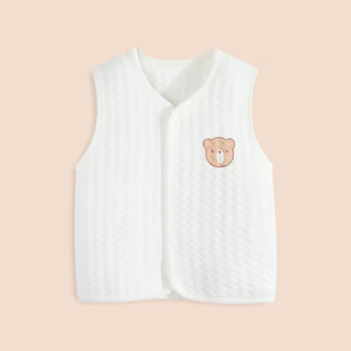 White baby vest with a bear emblem on a beige background soft cotton waistcoat/bodywarmer