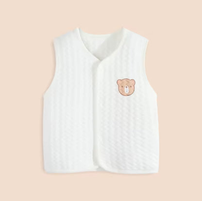 White baby vest with a bear emblem on a beige background soft cotton waistcoat/bodywarmer
