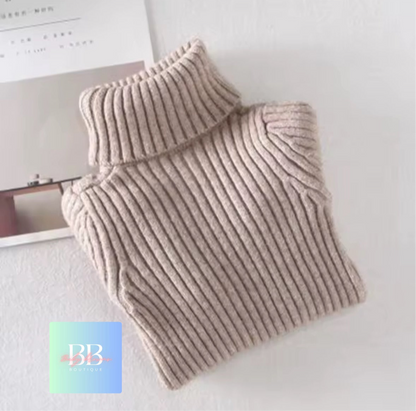 Beige ribbed sweater on a white surface with a brand logo in the corner.