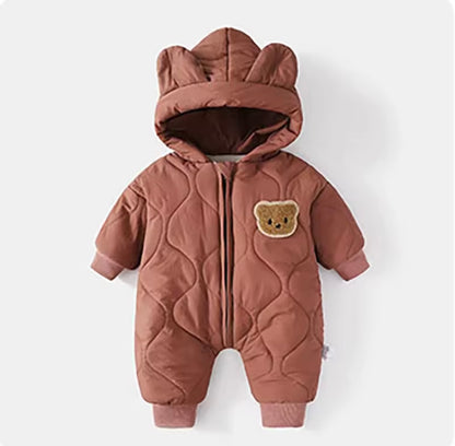 Brown quilted baby romper with bear ears and patch on a white background