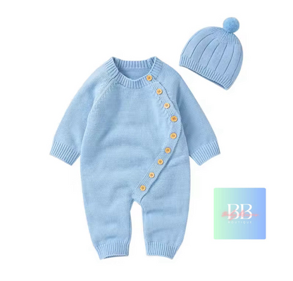 Light blue baby romper with buttons and matching hat on a white background