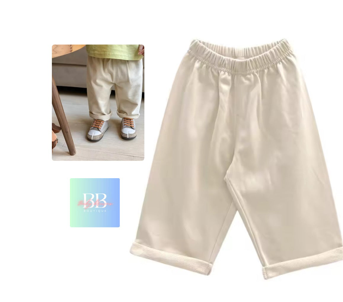 Beige pants displayed on a white background with a small inset showing a person wearing the pants.