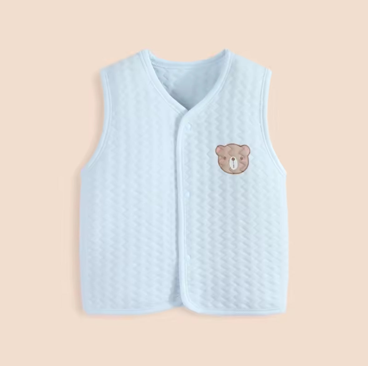 Light blue quilted vest with a teddy bear emblem on a beige background soft cotton waistcoat/bodywarmer