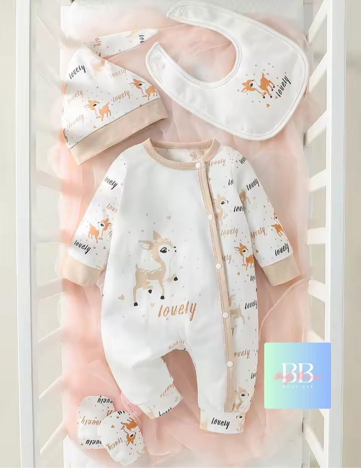 Baby clothing set with onesie, bib, and hat on a white background