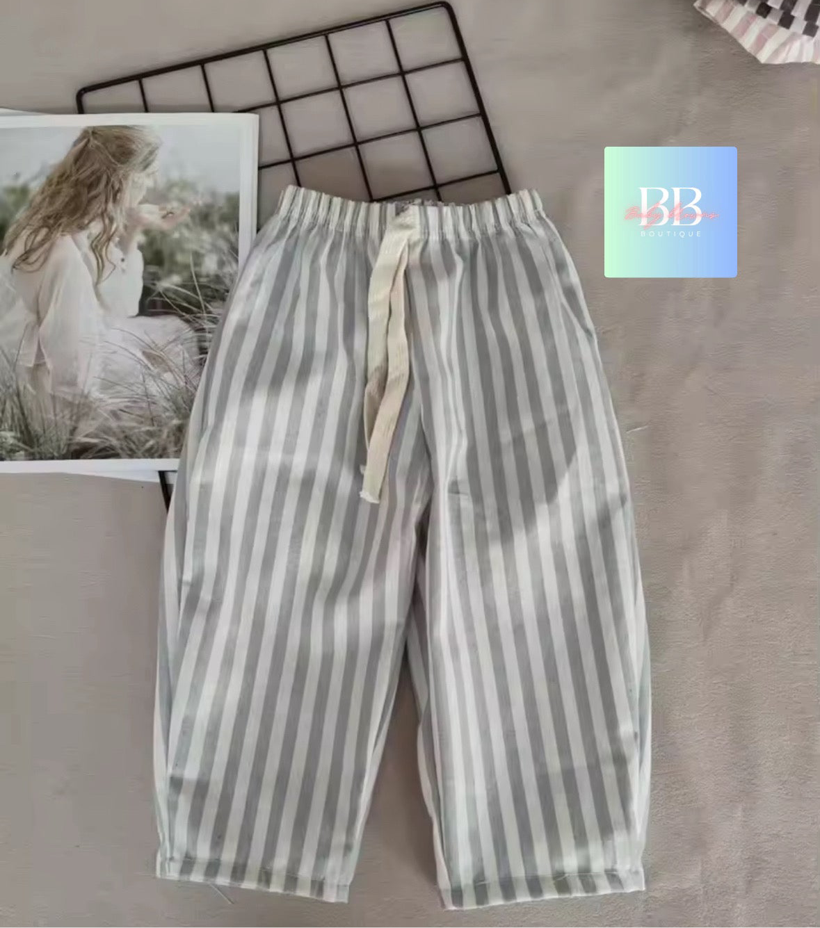 Striped pants on a surface with a blurred background