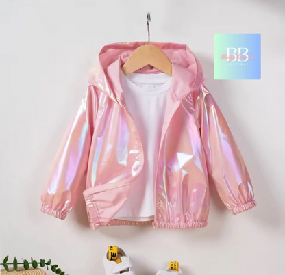 Pink holographic jacket on a hanger against a white background