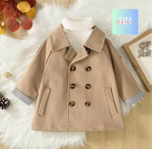 Beige coat with striped cuffs on a soft white background, featuring a brand logo in the corner.