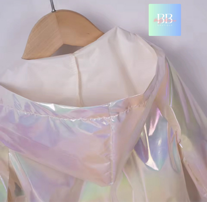 Iridescent fabric on a wooden hanger with a blurred background