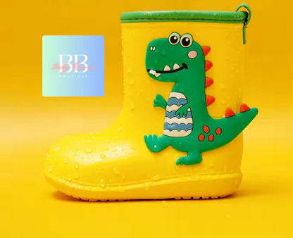 Yellow rain boot with a green dinosaur design on a yellow background