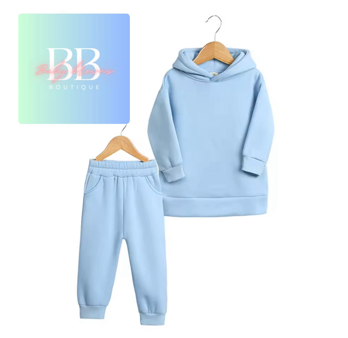 Light blue hoodie and pants set on hangers with 'BB Boutique' logo in the corner.