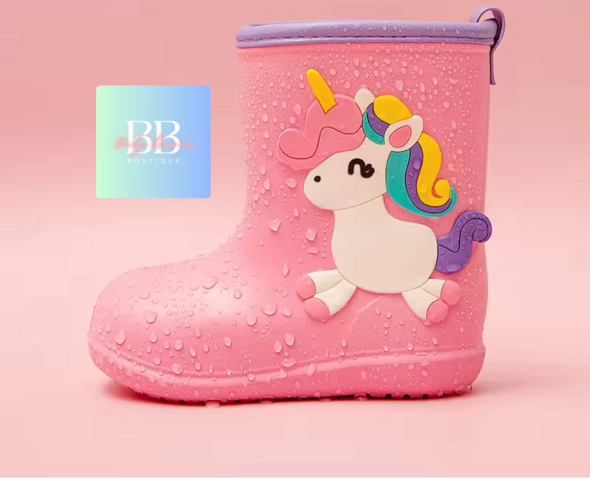 Pink rain boot with unicorn design on a pink background