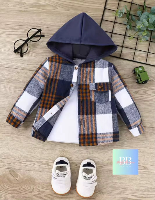 Plaid shirt with hood, shoes, and glasses on a wooden surface