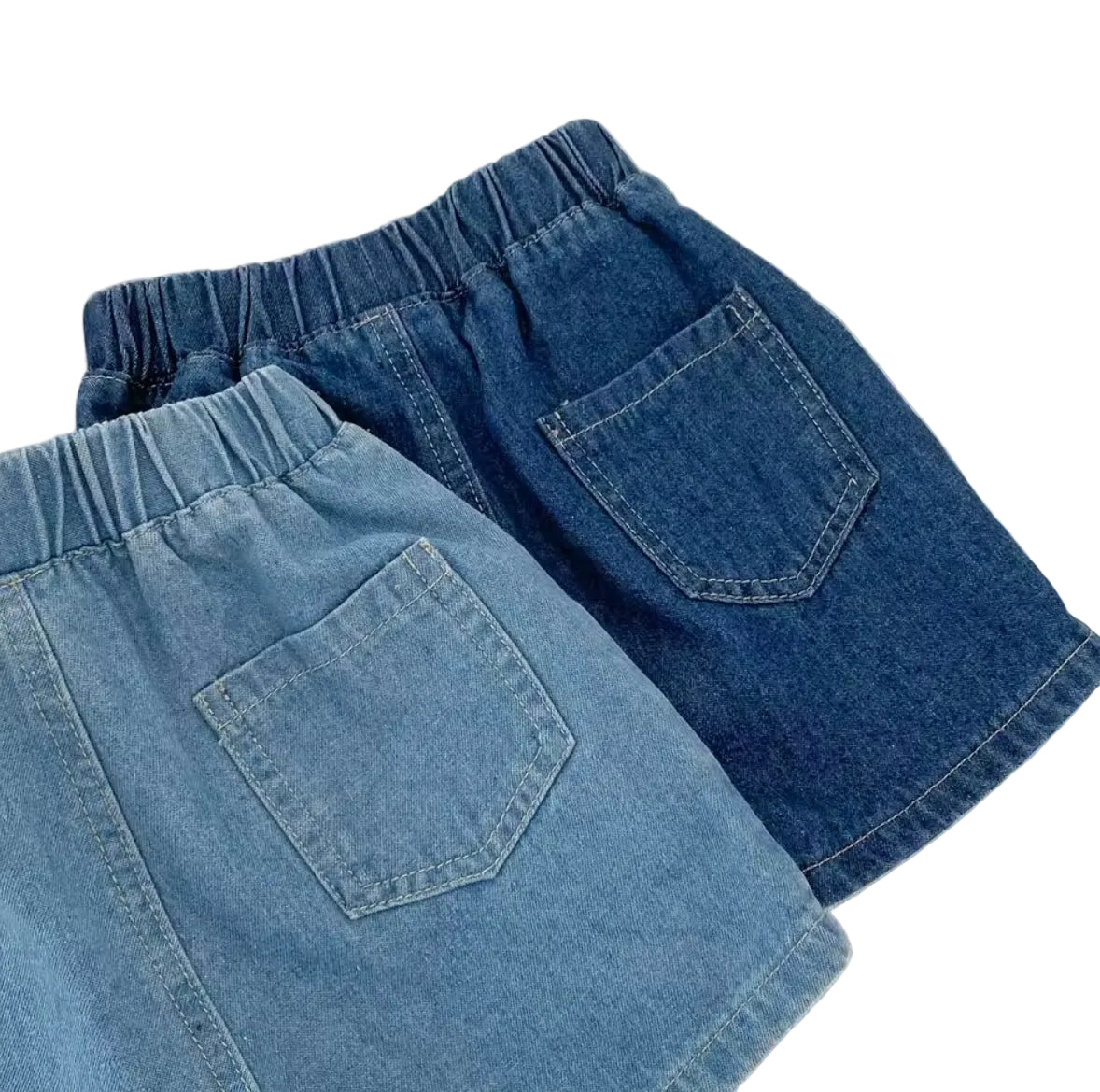 Pair of blue denim shorts on a light background