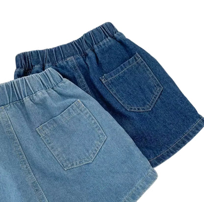Pair of blue denim shorts on a light background
