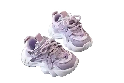 Pair of purple children's sneakers on a gray surface with 'XISHAN 731' branding in the background.