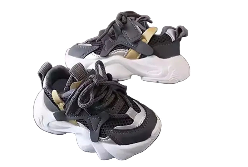 Pair of black and white sneakers on a gray surface with 'XISHAN 731' branding in the background.