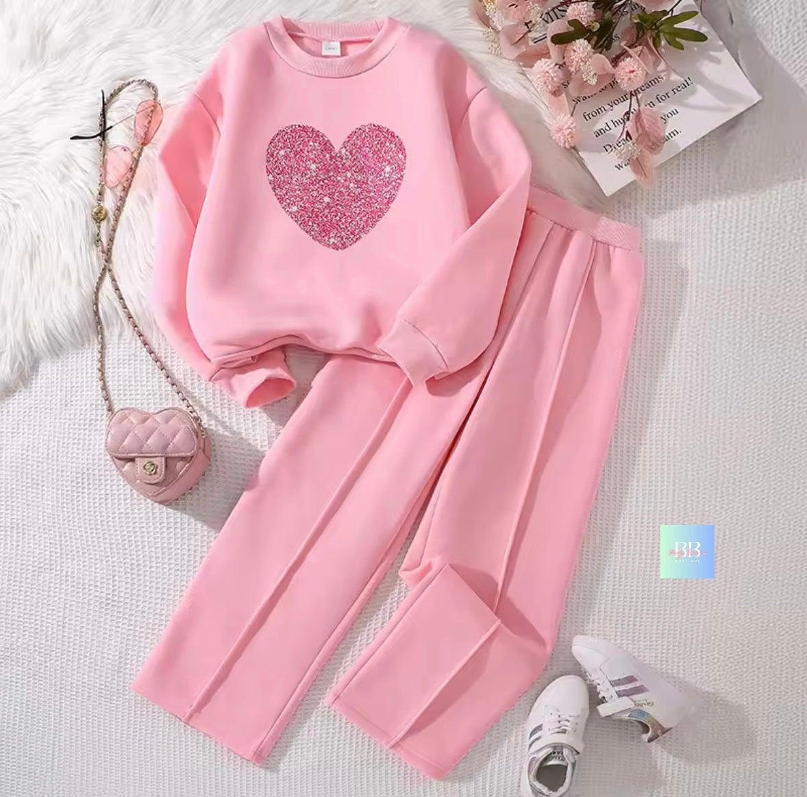 Pink outfit with heart design on a light background