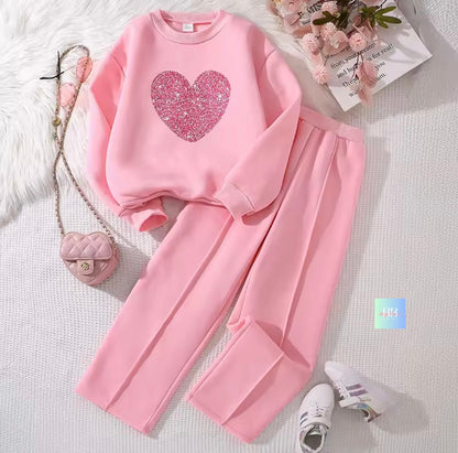 Pink outfit with heart design on a light background