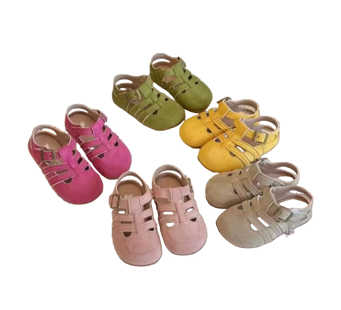 Colorful children's sandals on a white surface with a newspaper underneath.