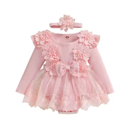Pink baby dress with floral details and matching headband on a white background