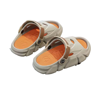 Beige sandals with brown soles on a gray surface, with 'CLOTHING' text in the background.