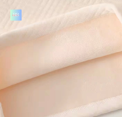 Close-up of beige fabric texture with a brand logo in the corner.