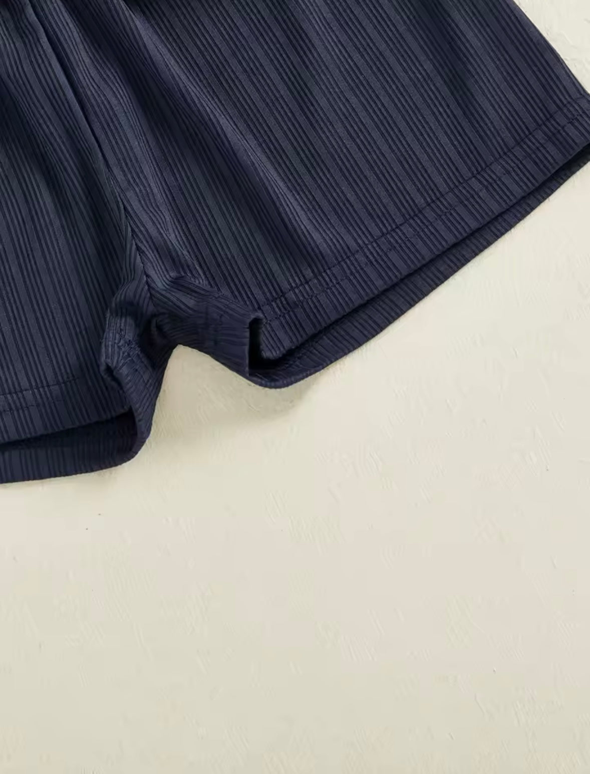 Navy blue fabric on a beige background