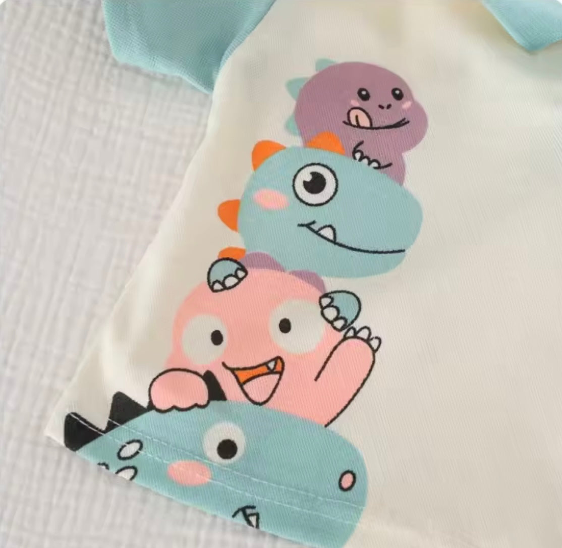 Children's clothing with cartoon monster design on a textured surface