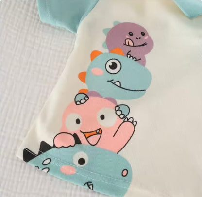 Children's clothing with cartoon monster design on a textured surface