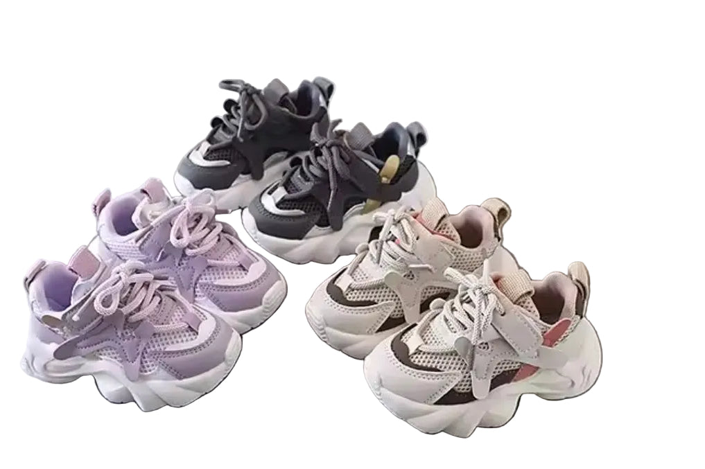 Three pairs of sneakers in different colors on a white background