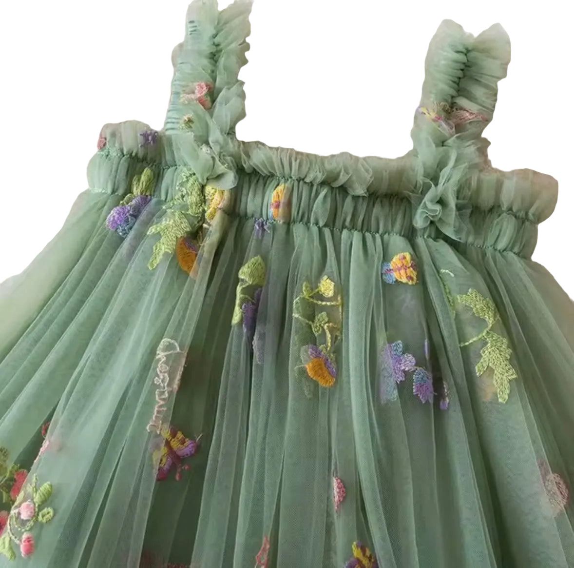 Green embroidered dress with floral details on a textured background