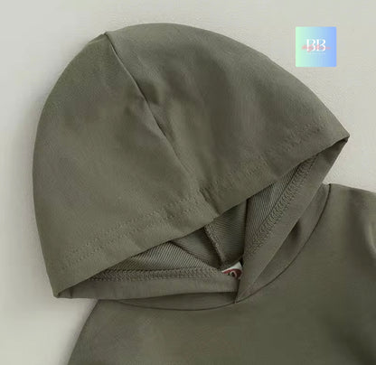 Green hooded garment on a light gray background