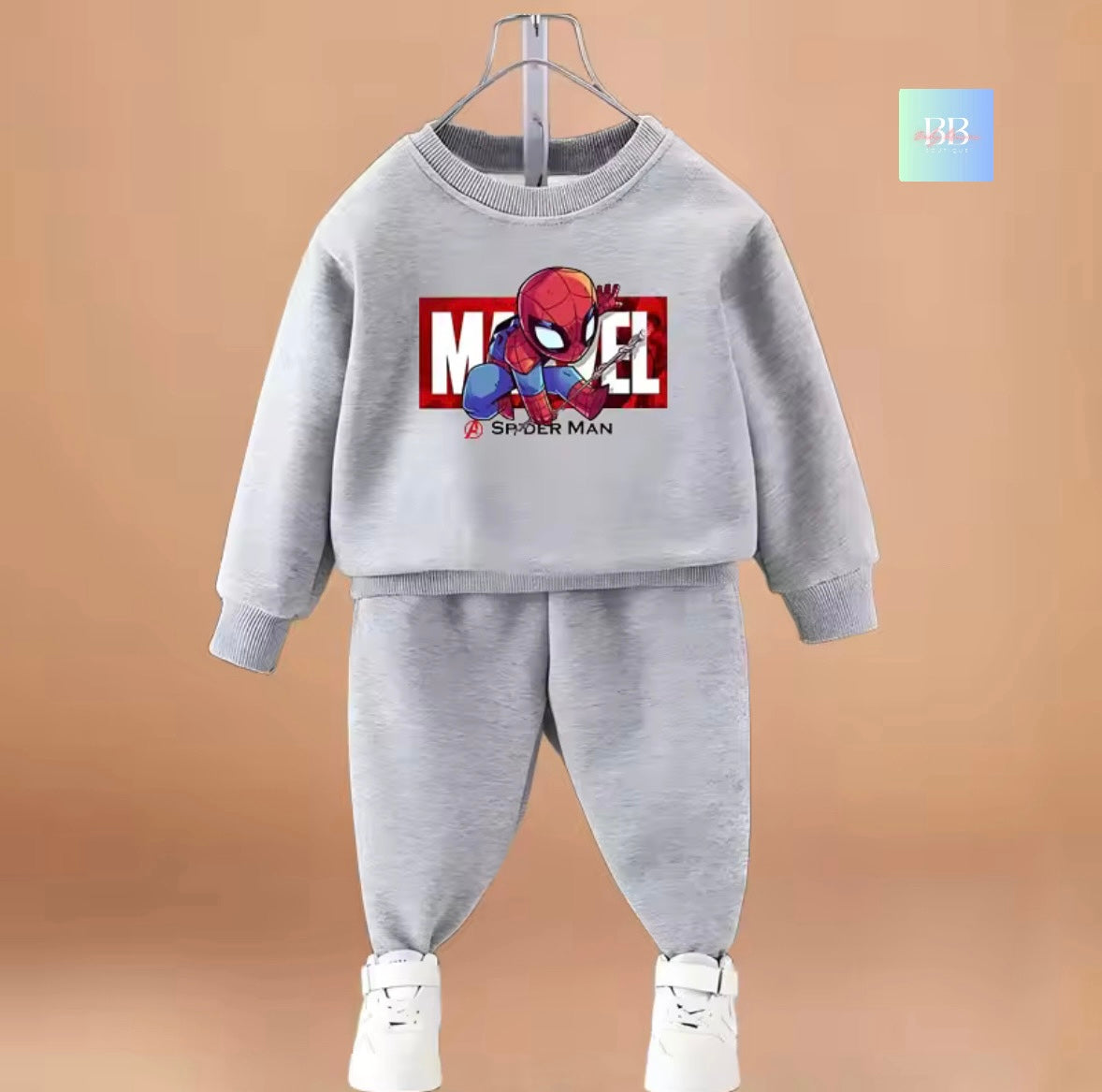 Gray children's sweatshirt and pants set with Spider-Man graphic on a beige background