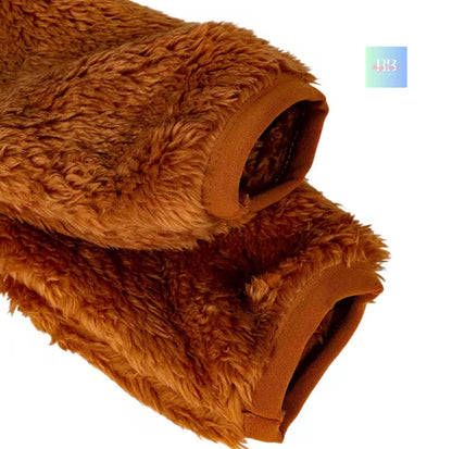 Brown fluffy blanket on a white background