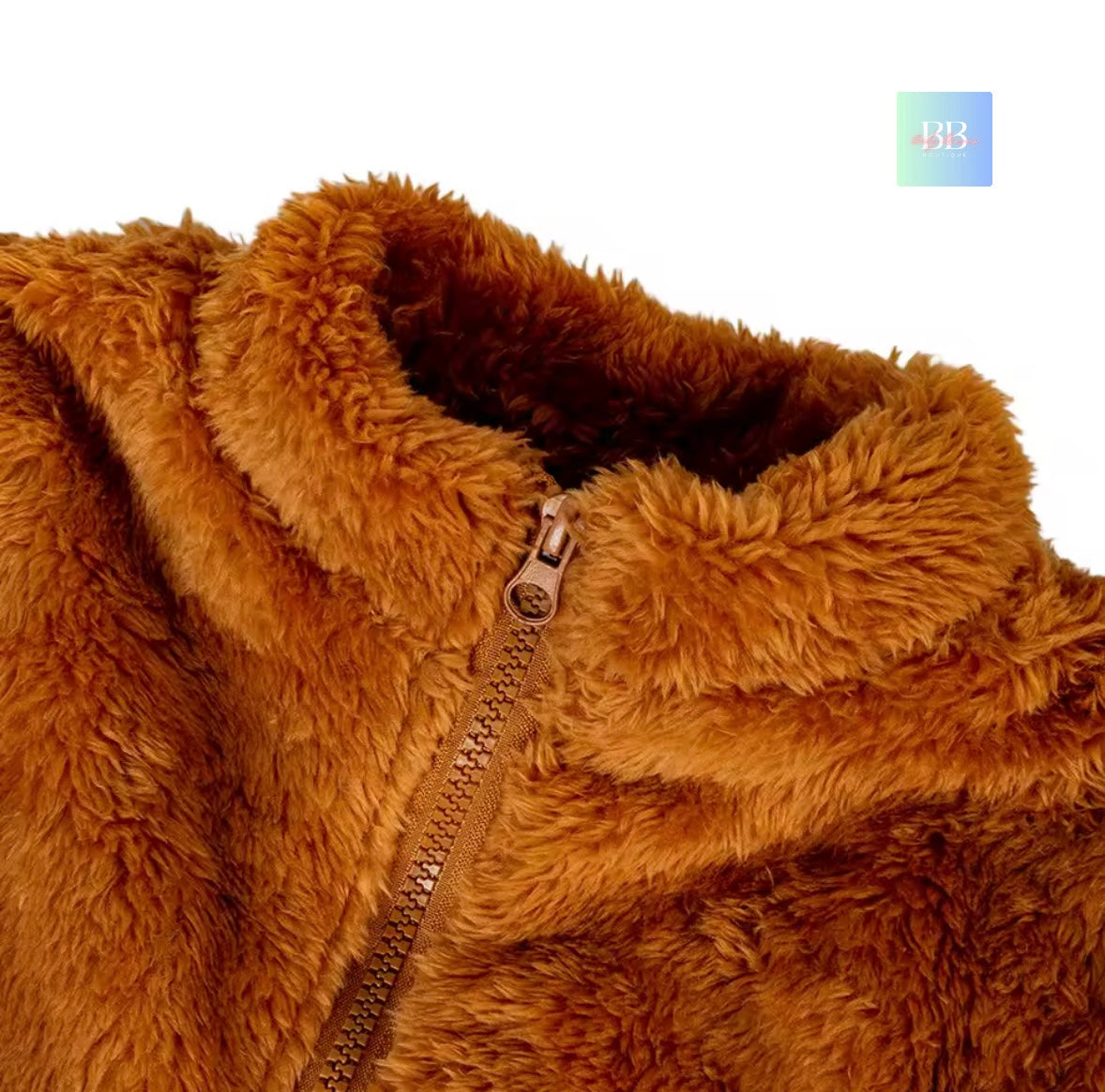 Close-up of a brown fuzzy jacket with a zipper on a white background