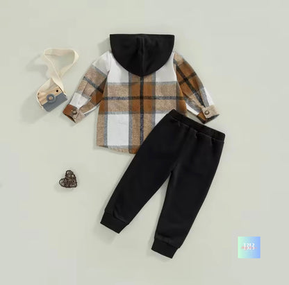 Children's plaid hoodie and black pants on a light gray background