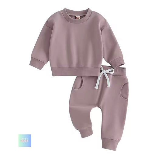 Children's mauve sweatshirt and pants set on a white background
