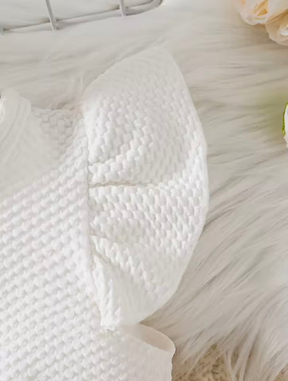 White textured pillow on a soft surface