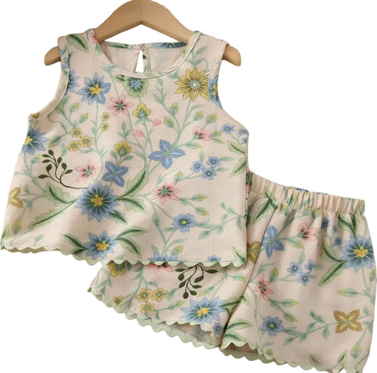 Floral-patterned apron and matching shorts on a textured surface
