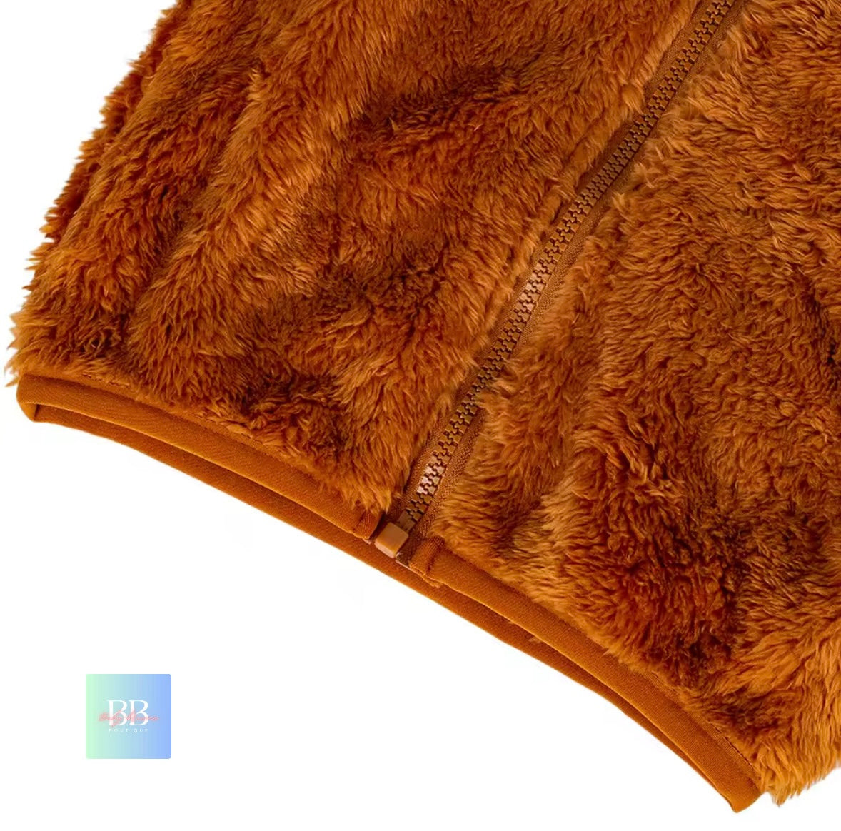 Brown fuzzy blanket with a zipper on a white background