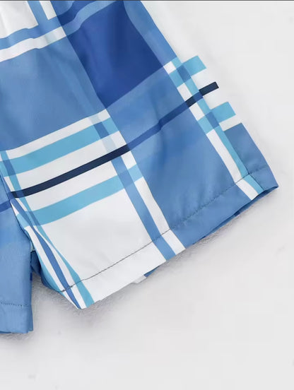 Blue plaid fabric on a white background