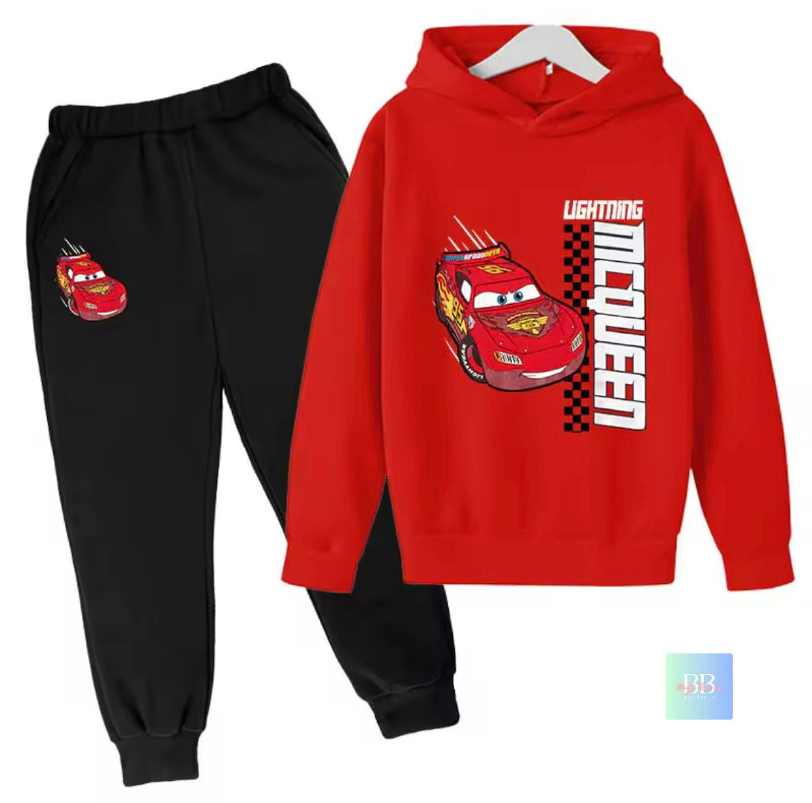 Red hoodie with Lightning McQueen design and black pants on a white background
