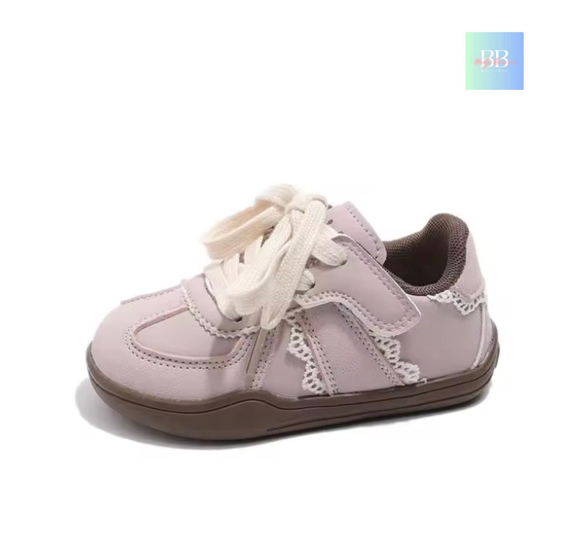 Children's light purple shoe with white laces on a white background