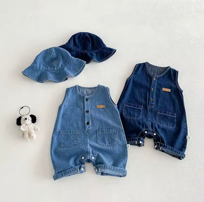 Two denim rompers and a matching hat on a light gray background