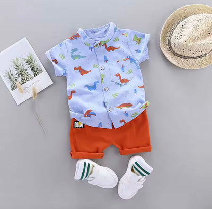 Children's outfit with shirt, shorts, socks, and hat on a gray background