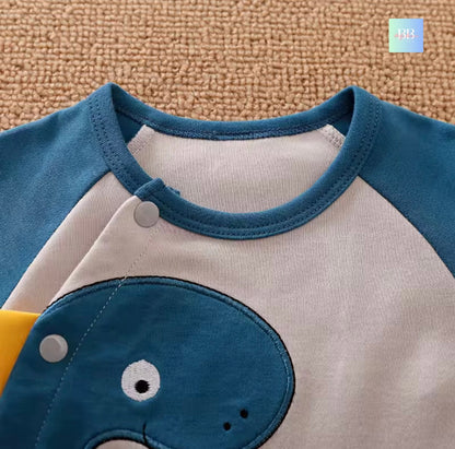 Children's shirt with blue and gray design on a textured surface