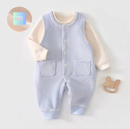 Baby romper with quilted design on a white background